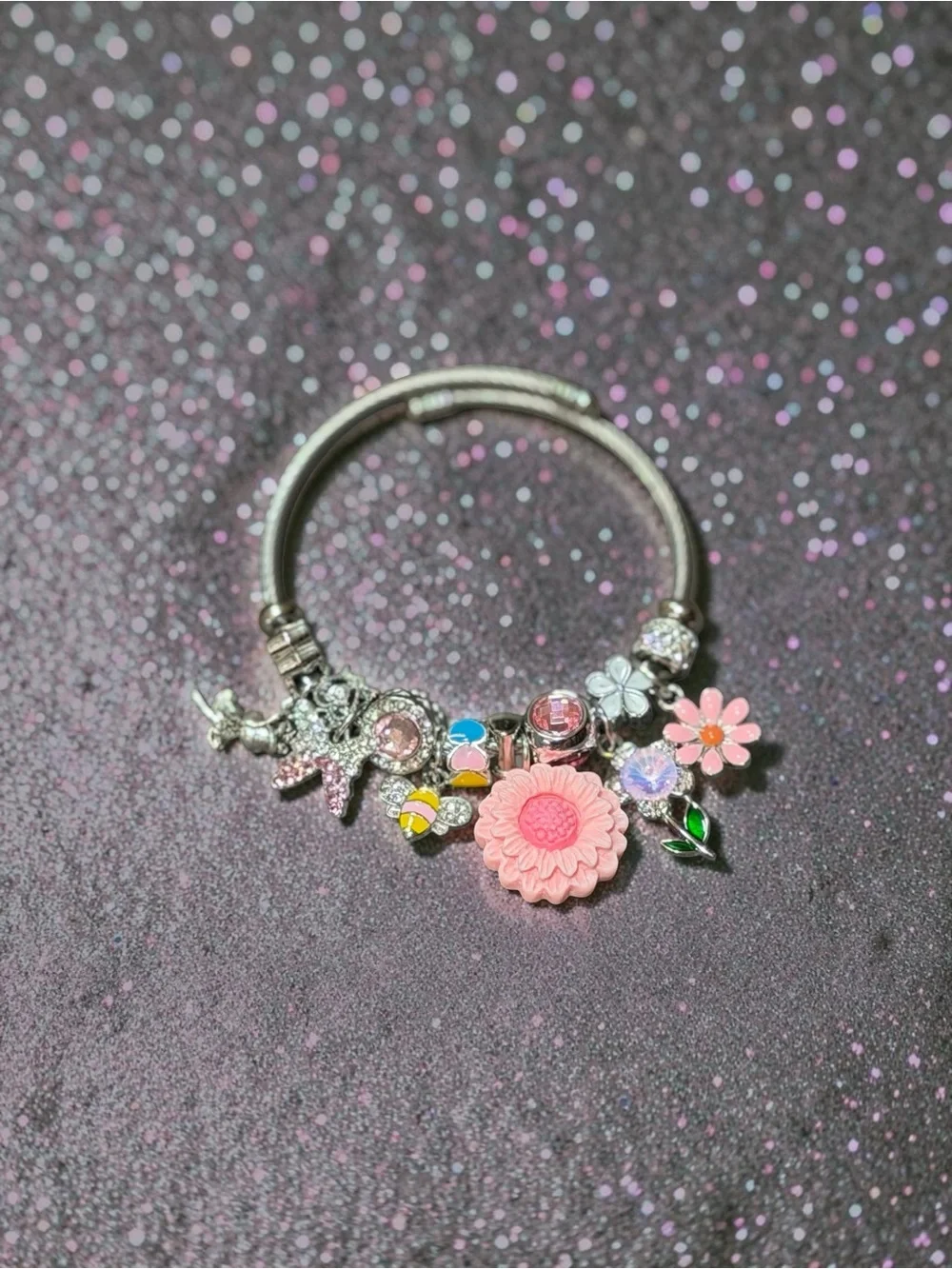 Silver Charm Adjustable Twisted Bangle with Pink Flower and Crystal Accents